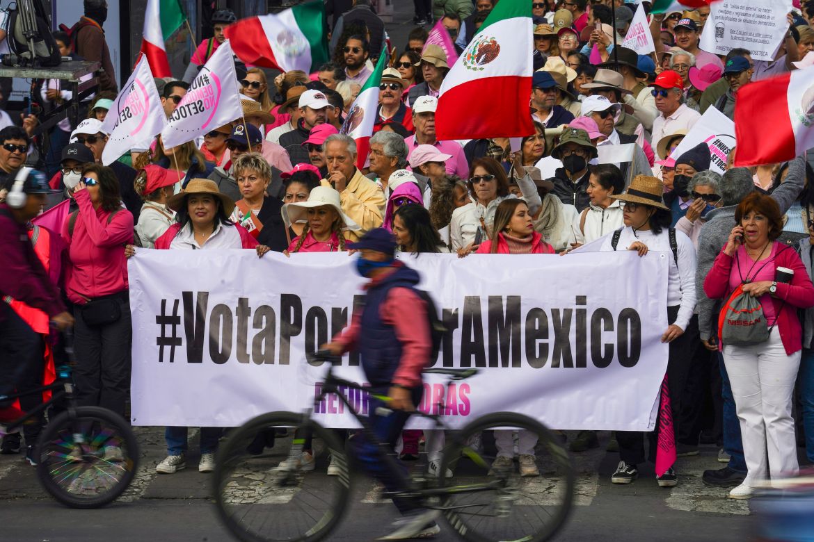 People take parte in a march organized by citizen organizations demanding that electoral autonomy be respected in the upcoming general elections in downtown Mexico City