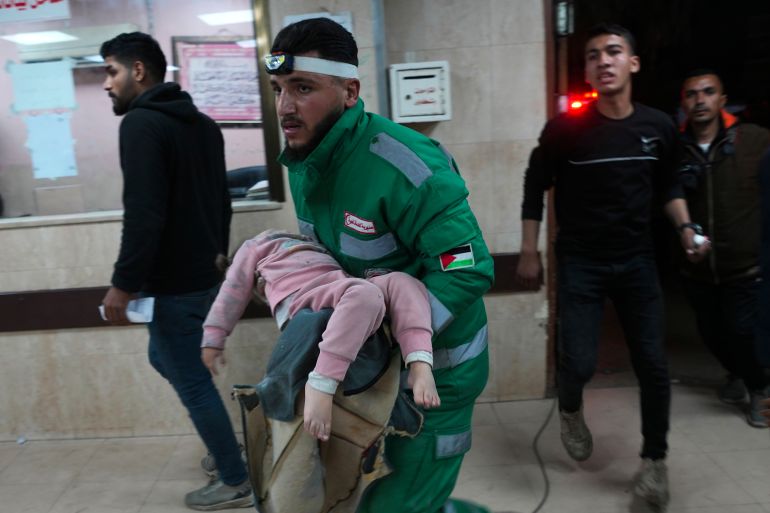 Palestinians wounded in the Israeli bombardment of the Gaza Strip are brought to Al Aqsa hospital in Deir al Balah, Friday, Feb. 23