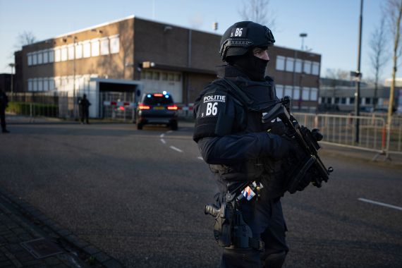A vehicle carrying suspects arrives at the high security court in Amsterdam, Netherlands