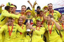 Australia captain Hugh Weibgen lifts the ICC Under-19 Cricket World Cup trophy with teammates as they celebrate after defeating India in the final in South Africa [Courtesy of International Cricket Council]