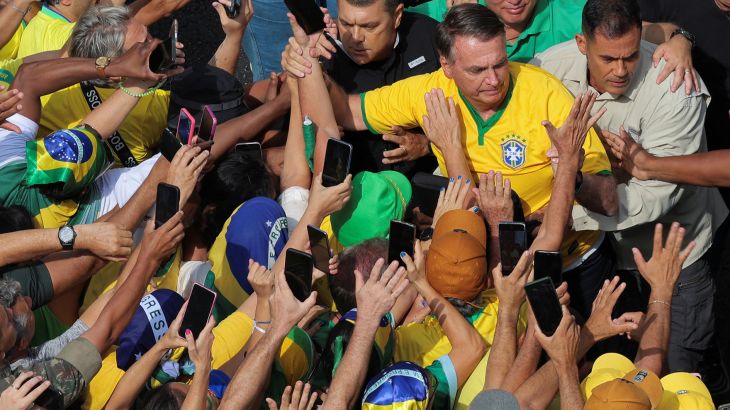 Pro-Bolsonaro supporters gather with Jair Bolsonaro.