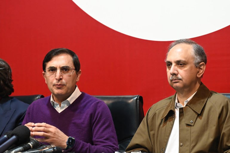 PTI leadership has nominated Omar Ayub Khan (right) as its candidate for prime minister in the upcoming parliamentary session. [Sohail Shahzad/EPA]