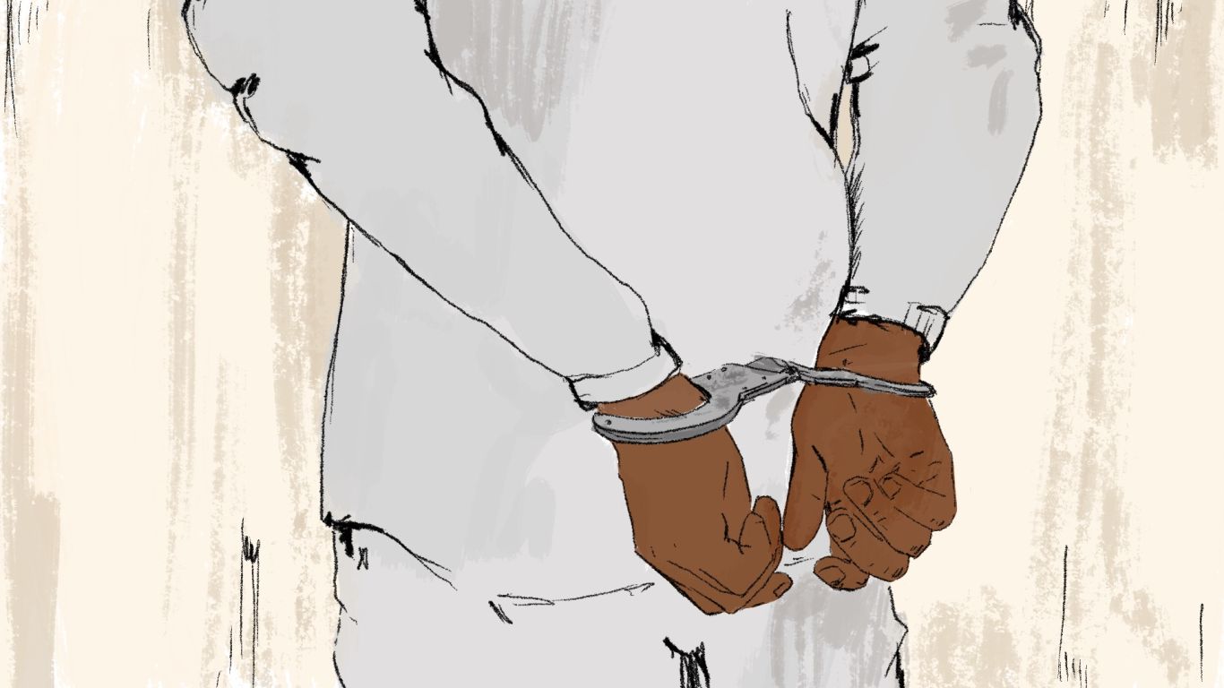 An illustration of a person who is a prisoner with handcuffs behind their back.