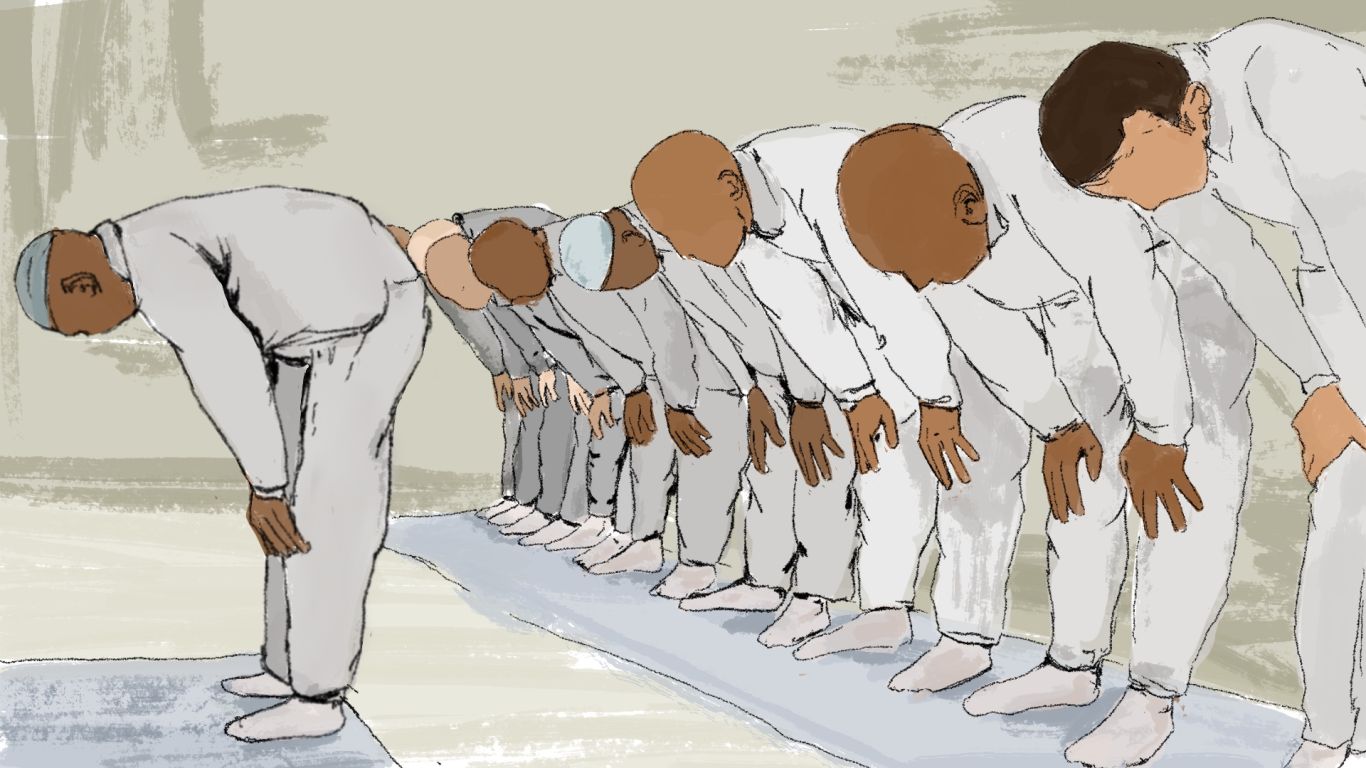 An illustration of people who are Muslim prisoners praying with one person leading the prayer in the front and 8 people standing in a row behind him.