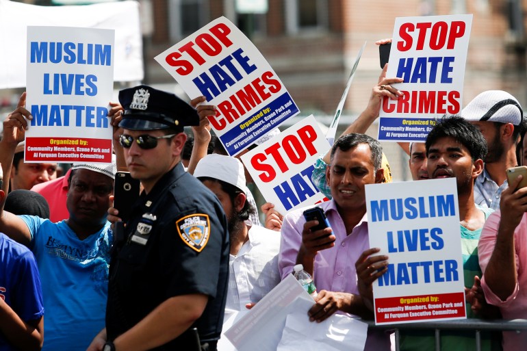 People take part in a protest against hate crimes