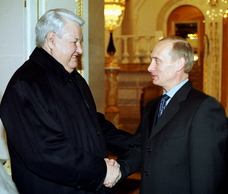 FILE PHOTO: Russian President Vladimir Putin (R) shakes hands with former Russian President Boris Yeltsin in the Kremlin in Moscow, December 31, 2000. Putin met Yeltsin for talks on the country's economic and social situation on Sunday, a year to the day when Yeltsin resigned and handed the reins of power to Putin. REUTERS/File Photo