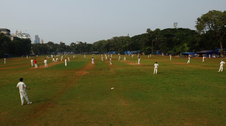 A general view as matches of cricket take place parallel to each other with outfields and fielders merging between the pitches at Cross Maidan Garden, Mumbai, India - October 18, 2023 REUTERS/Andrew Boyers