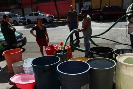 People fill buckets with water from a water tanker truck in the Azcapotzalco neighborhood, as tensions over water scarcity in Mexico City, one of Latin America's largest capitals, are boiling over as residents in some neighborhoods protest weeks-long dry spells in their homes, in Mexico City, Mexico January 26, 2024