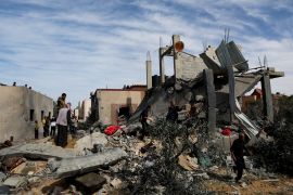 Palestinians gather at the site of an Israeli strike on a house in Rafah on March 1, 2024.