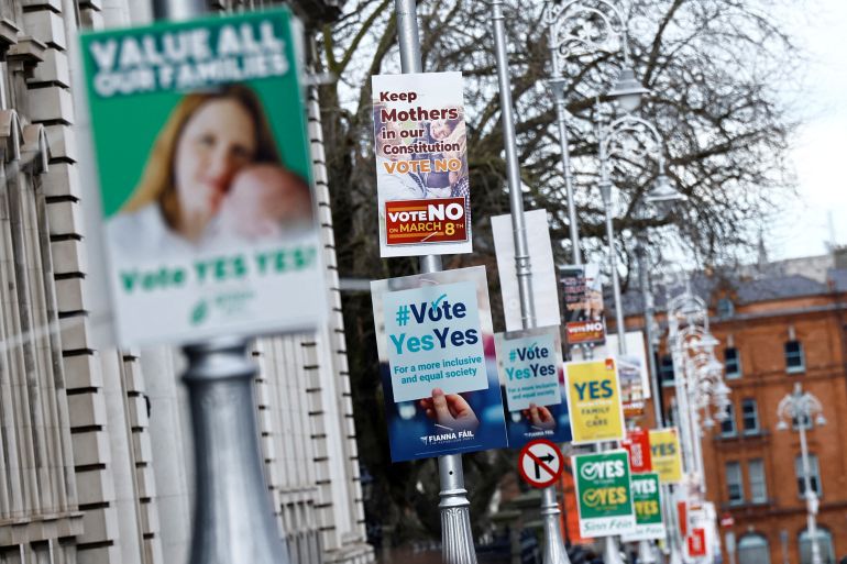 Signage urging for a yes or no vote hang on lamp posts in Dublin.