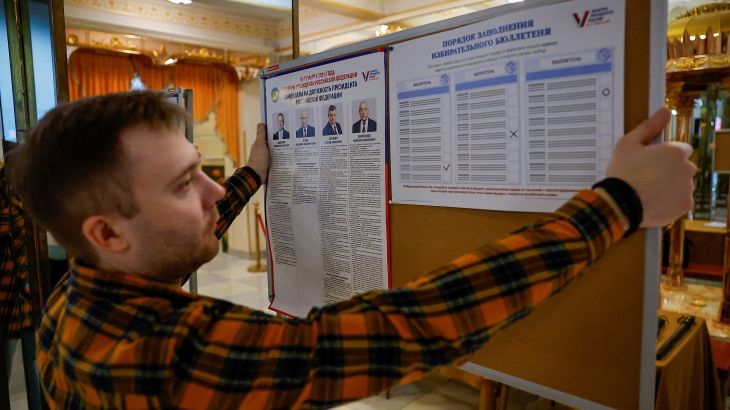 A member of a local electoral commission works at a polling station during preparations for the presidential election, in Moscow, Russia, March 14, 2024. REUTERS/Evgenia Novozhenina