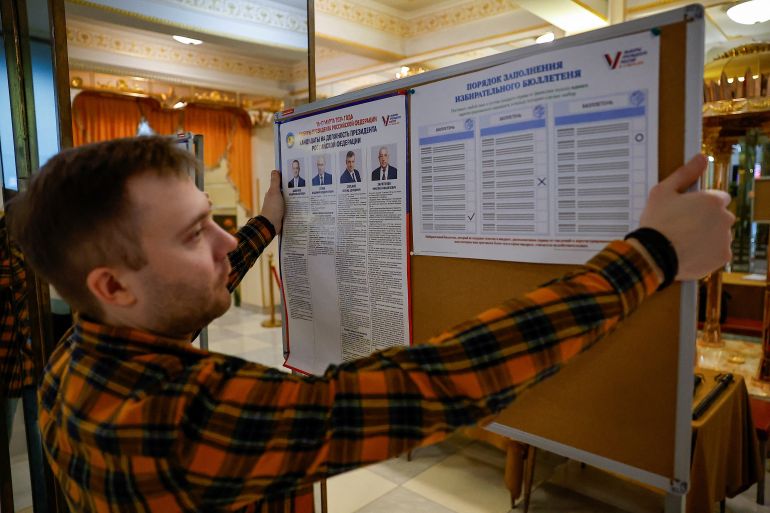 A member of a local electoral commission works at a polling station during preparations for the presidential election, in Moscow, Russia, March 14, 2024. REUTERS/Evgenia Novozhenina