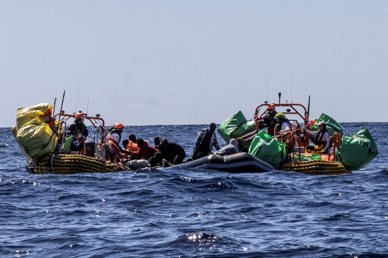 Migrants are rescued by crew members of the rescue ship Ocean Viking