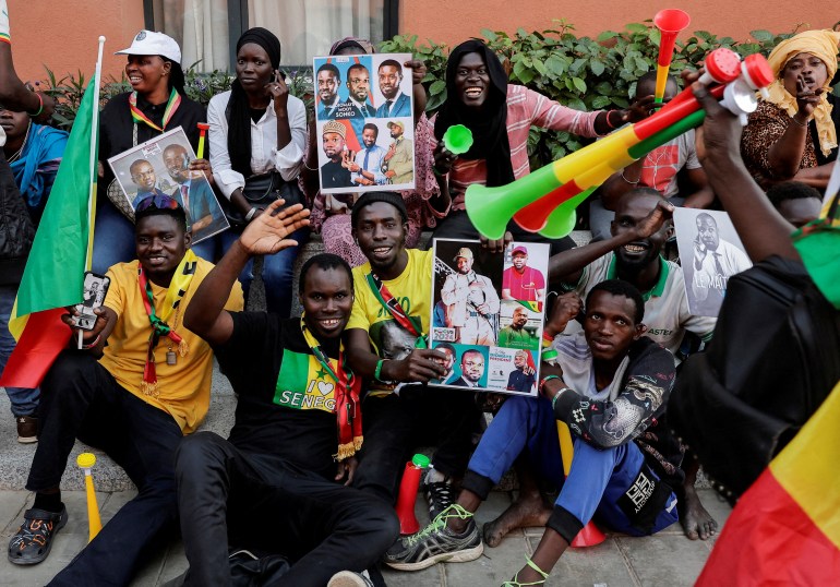 Supporters cheer Senegalese opposition leaders