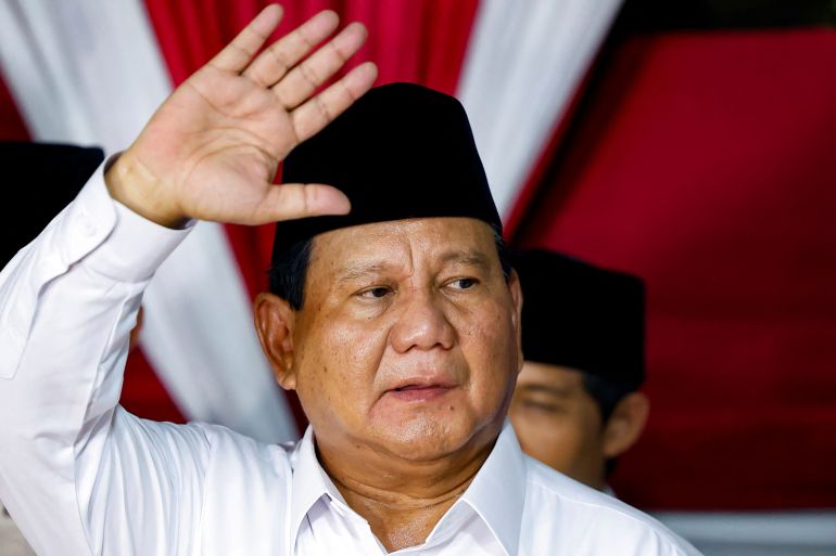 Prabowo Subianto waves after the elections commission confirmed he won last month's election.