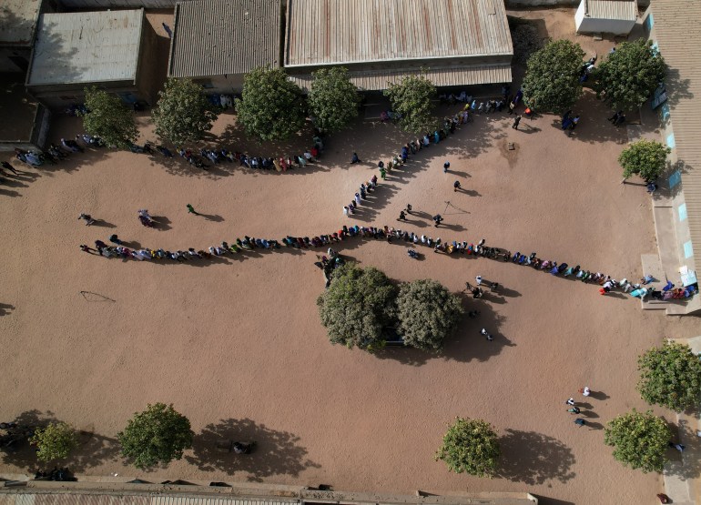 A drone view of people lining up to vote at the polling station at Ndiaganiao in Mbour, Senegal