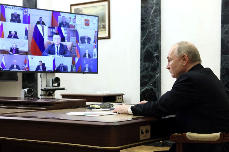 Russian President Vladimir Putin chairs a meeting, held to discuss aftermaths and measures taken after the attack on the Crocus City Hall concert venue, at a residence outside Moscow, Russia, March 25, 2024