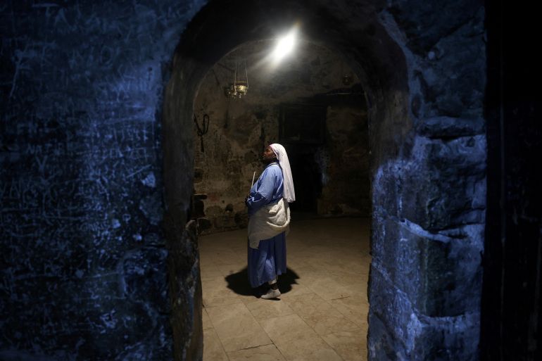 A nun attends the Catholic Washing of the Feet ceremony during Easter Holy Week in the Church of the Holy Sepulchre in Jerusalem's Old City