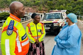 Emergency workers at the site of the crash [Limpopo Department of Transport and Community Safety via Reuters]