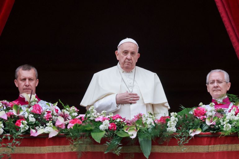 Pope Francis looks on from a balcony, on the day he delivers his "Urbi et Orbi" (To the city and the world) message at St. Peter's Square, on Easter Sunday, at the Vatican March 31, 2024. REUTERS/Yara Nardi
