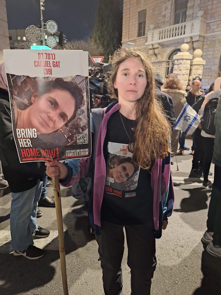 Shay Bicknanm attends a protest in downtown Jerusalem to call for the release of Israeli captives in Gaza. Her cousin was taken on October 7 and her aunt was killed. [Mat Nashed/Al Jazeera]