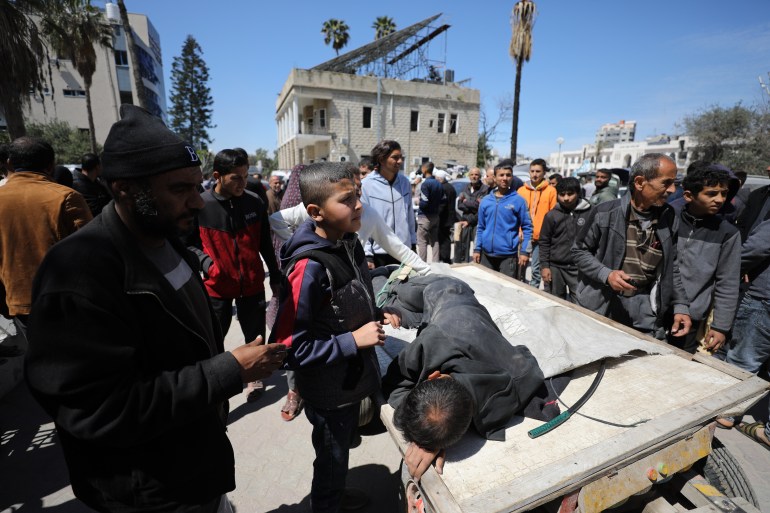 Wounded Palestinians, including children, are taken to al-Ahli Baptist Hospital after Israel hit Palestinians waiting for humanitarian aid at Kuwait Junction in Gaza City, Gaza on March 23