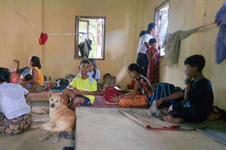 People rest in a monastery that has turned into a temporary shelter for internally displaced people (IDPs) at a village in Pauktaw township in Myanmar's western Rakhine State.