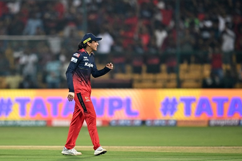 Royal Challengers Bangalore's captain Smriti Mandhana gestures during the Women's Premier League (WPL) Twenty20 cricket match between Royal Challengers Bangalore and UP Warriorz at the Chinnaswamy Stadium in Bengaluru on February 24, 2024. (Photo by Idrees MOHAMMED / AFP)