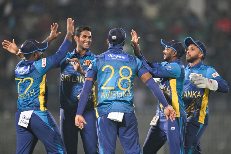 Sri Lanka's players celebrate after the dismissal of Bangladesh's Soumya Sarkar during the first Twenty20 international cricket match between Bangladesh and Sri Lanka at the Sylhet International Cricket Stadium in Sylhet on March 4, 2024. (Photo by MUNIR UZ ZAMAN / AFP)