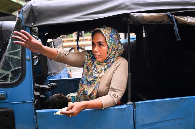 shows Bajaj driver and single mother Ekawati, who plies her three-wheeled taxi in a profession overwhelmingly dominated by men