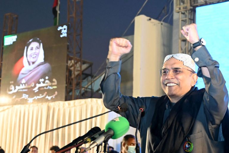 (FILES) Former President of Pakistan and President of Pakistan Peoples' Party (PPP), Asif Ali Zardari gestures towards supporters during a campaign rally for the 2024 general elections on the sixteenth anniversary of his wife's assasssination, former Prime Minister of Pakistan, Benazir Bhutto, in Garhi Khuda Bakhsh village, Larkana on December 27, 2023. - Asif Ali Zardari, the widower of Pakistan's slain first female premier Benazir Bhutto who has had a life storied equally by tragedy and farce, is set to become president for a second time on March 9, 2024. (Photo by Ahmed Raza Soomro / AFP)