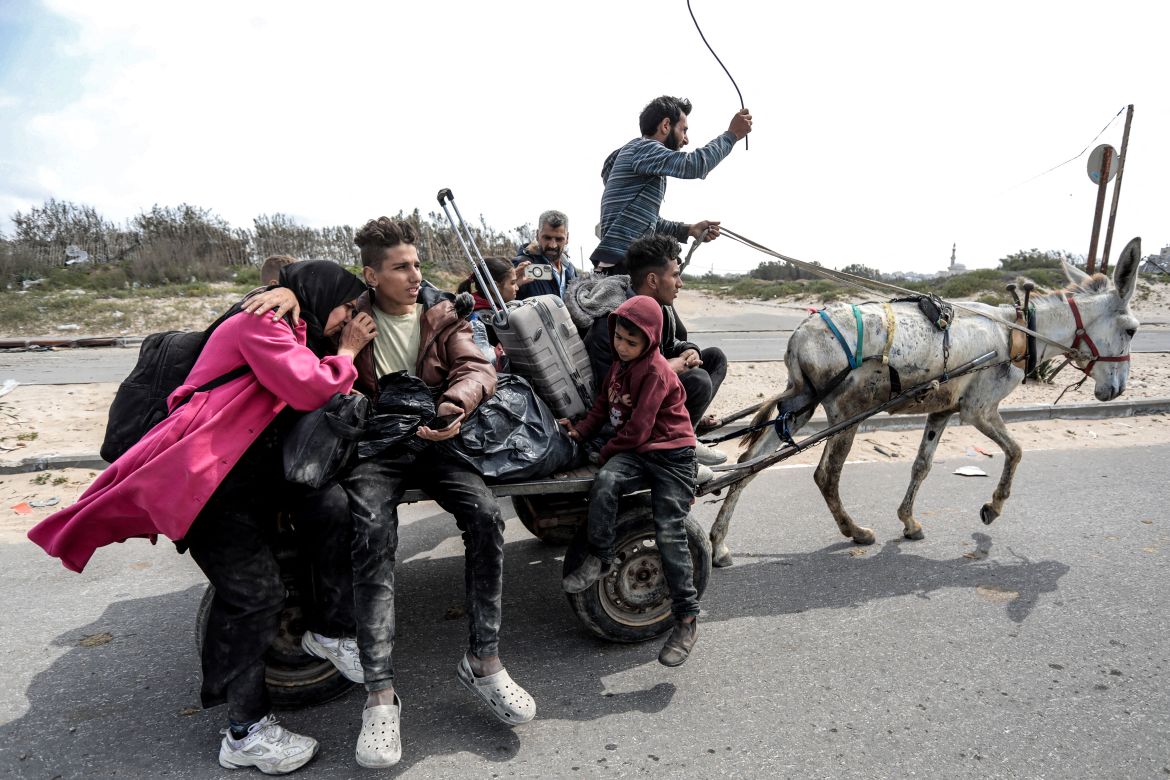 Palestinians flee the area after Israeli bombardment in central Gaza City