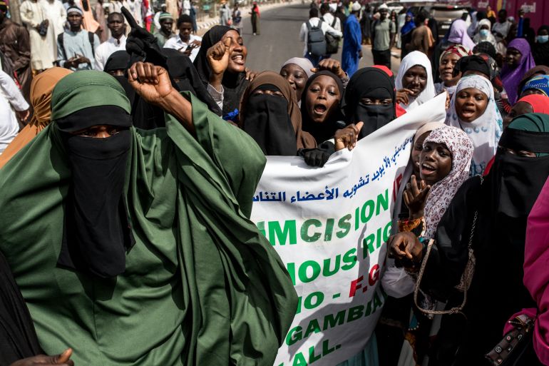 Pro Female Genital Mutilation (FGM) protesters gather outside the National Assembly in Banjul, Gambia, on March 18, 2024, during a debate between lawmakers on a highly controversial bill seeking to lift the ban on FGM