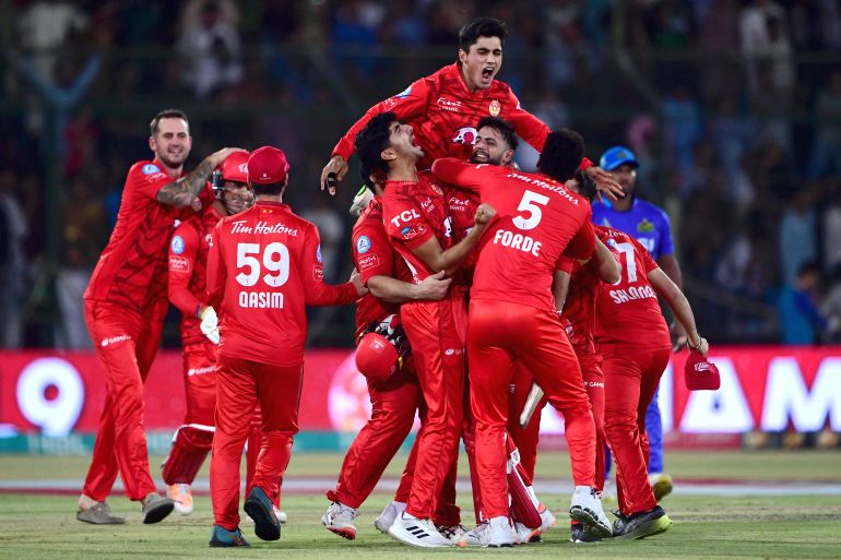 Islamabad United's players celebrate their victory at the end of the Pakistan Super League (PSL) Twenty20 cricket final match between Islamabad United and Multan Sultans