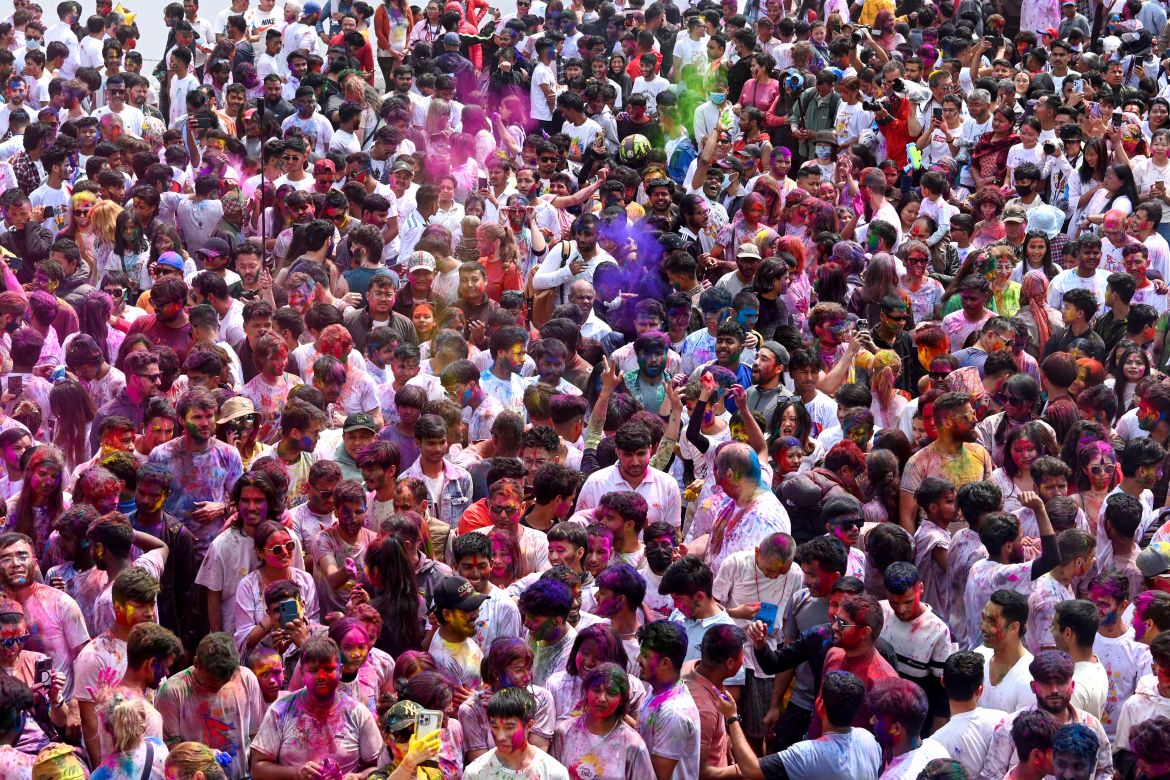 Revellers play with coloured powders as they celebrate Holi, the Hindu spring festival of colours, in Kathmandu