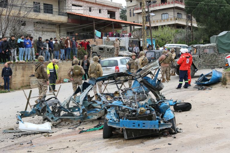 Lebanese soldiers cordon off the site of an Israeli drone attack targeting a vehicle in the town of Souairi, in western Bekaa Valley in central Lebanon on March 24