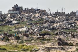 This picture taken from Israel's southern border with the Gaza Strip shows buildings previously destroyed by Israeli strikes