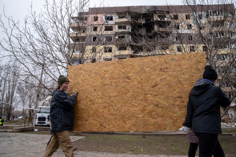 Local residents are carrying a piece of chipboard
