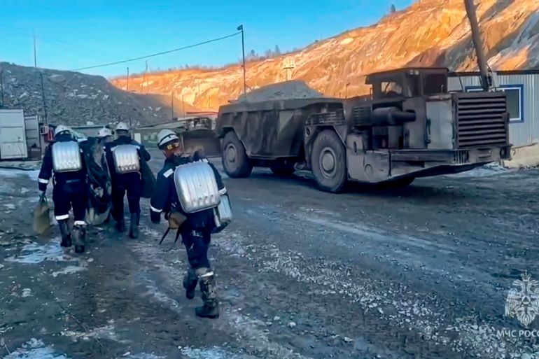 Russia Emergency Situations employees walk to the collapsed gold mine in Zeysk district, Amur region, eastern Russia