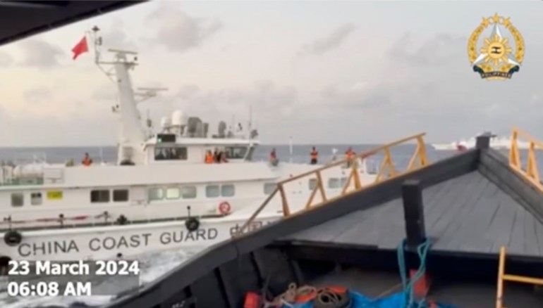 The Chinese coast guard ship seen from the bow of the Unaizah May 4. The Chinese vessel is white and Coast Guard is written on the side, There are several people standing on the deck. It is very close.