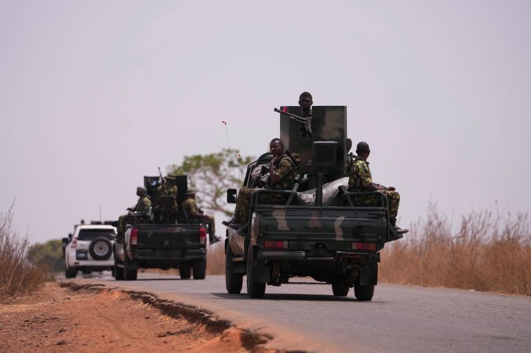 Nigerian military patrol on highways around Kuriga where hundreds of students were kidnapped