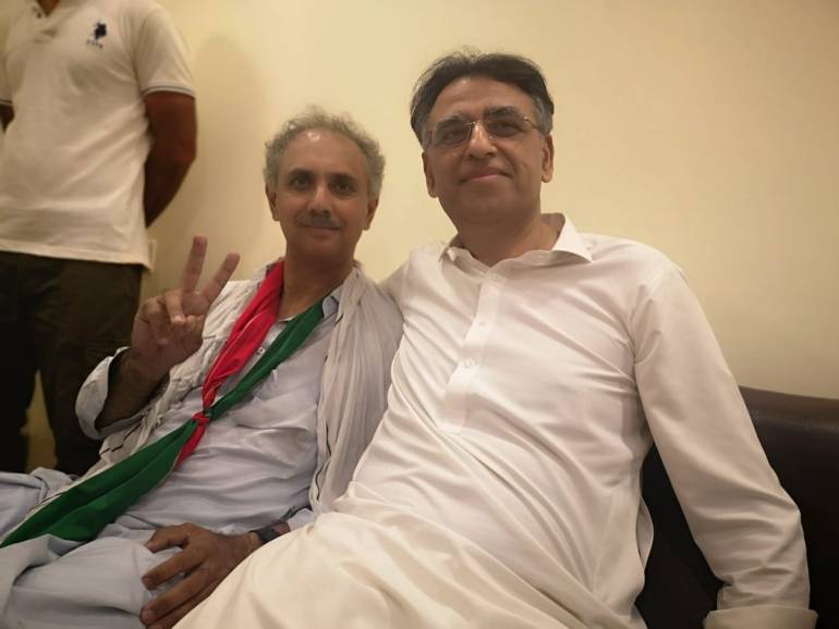 Omar Ayub Khan with Asad Umar, his PTI colleague after being attacked by police in May 2022. [Courtesy of Omar Ayub Khan]