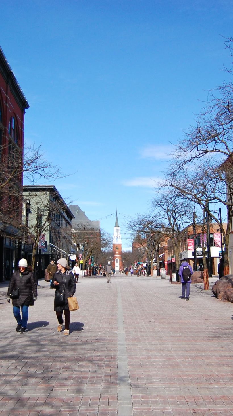 People walk on Church Street in downtown Burlington, Vermont, US