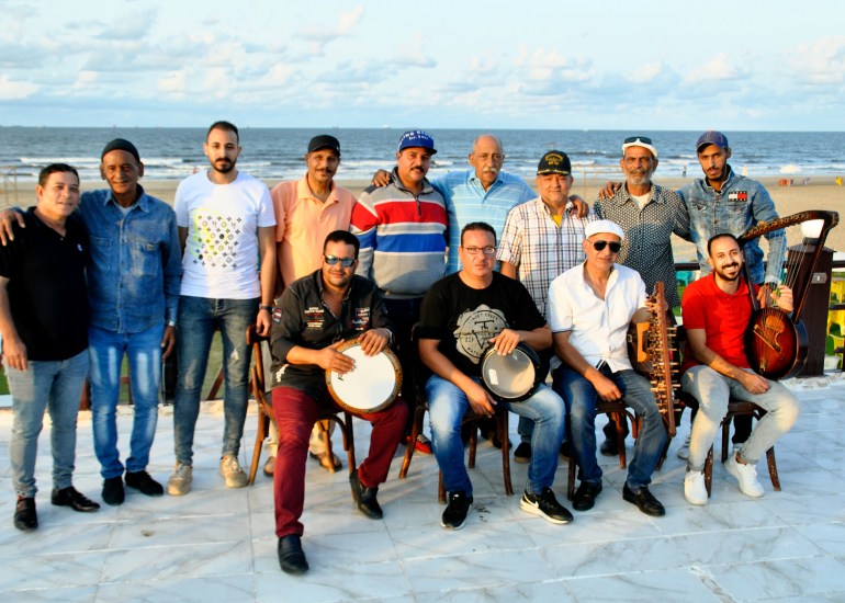 The El Tanbura group pose by the sea in 2020