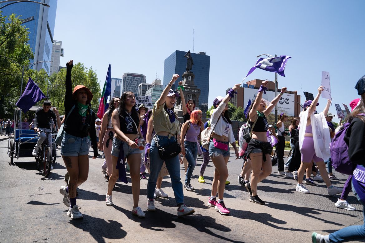 Before the official start of the march, women came together from different parts of the city to join the crowd that would become over 180,000-strong [Lexie Harrison-Cripps / Al Jazeera]