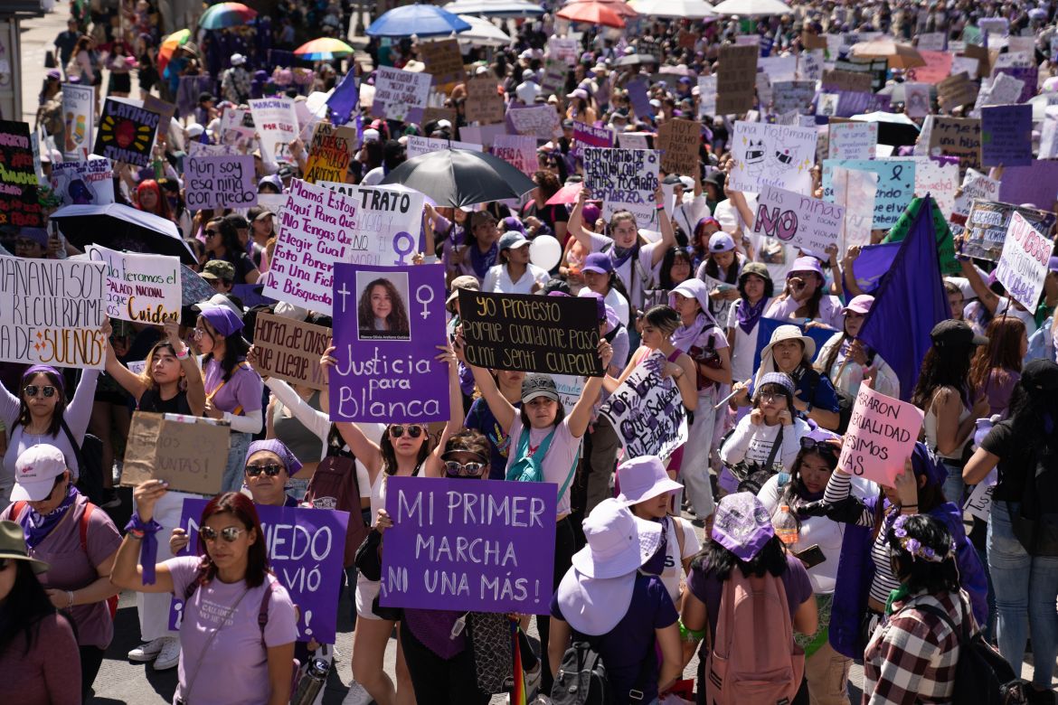 Over 180,000 protesters marched through Mexico City with various demands including access to justice, freedom from violence and fear or with photos of people they were accusing of rape or violence. Some banners demanded that girls grow up without violence whilst others were specific to absent women who had been killed [Lexie Harrison-Cripps / Al Jazeera]
