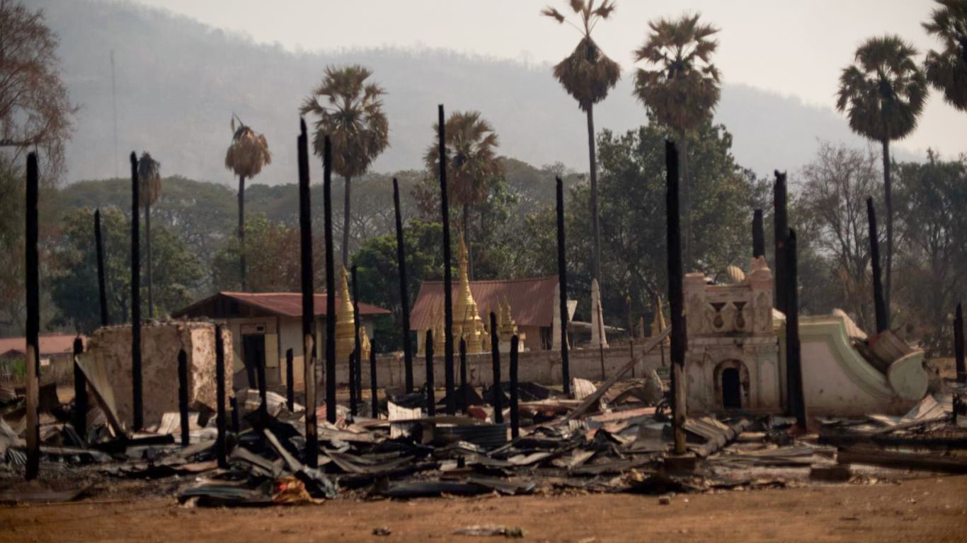 Blackened trees and burned down buildings in Shadaw.