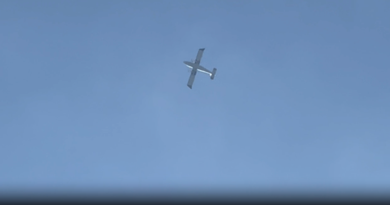 A Myanmar military spy plane in the air above Kayah state