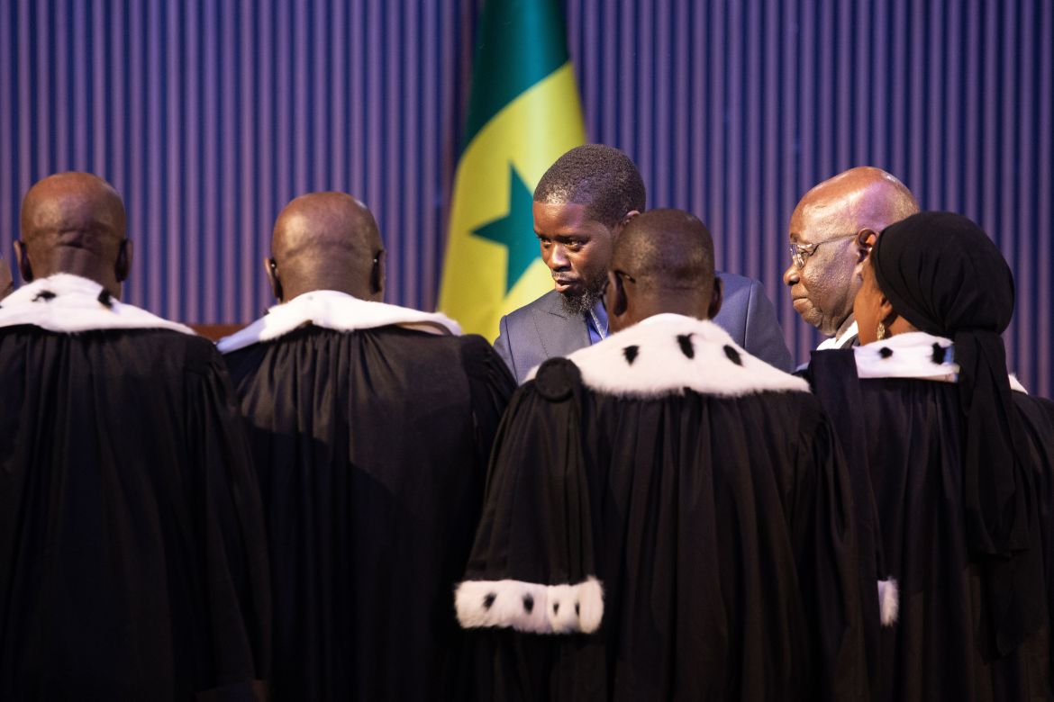 Newly sworn in Senegalese President Bassirou Diomaye Faye, (C), is congratulated by judges from the Constitutional Council during his inauguration ceremony at the Abdou Diouf International Convention Centre in Diamniadio, Senegal