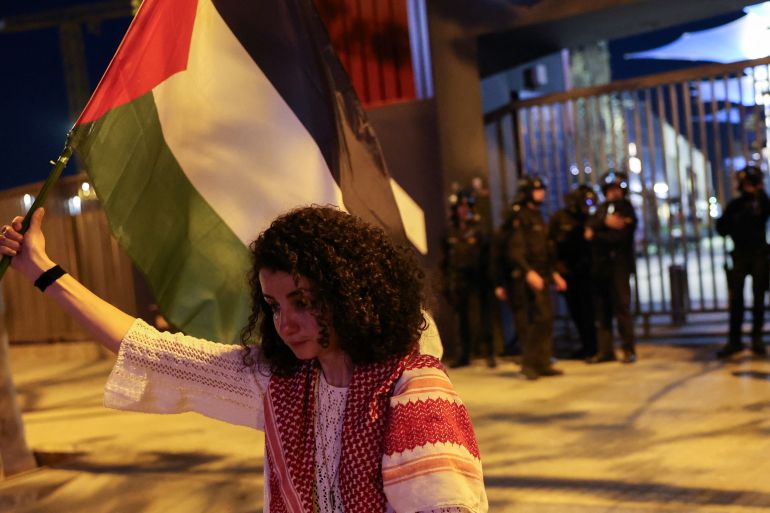 Palestinian Mervat Alramli, 31, cries as she holds her Palestinian flag in a protest at the Euroleague Basketball between Barcelona vs Maccabi Tel-Aviv Basketball outside the stadium in Barcelona, Spain, April 4, 2024. REUTERS/Nacho Doce